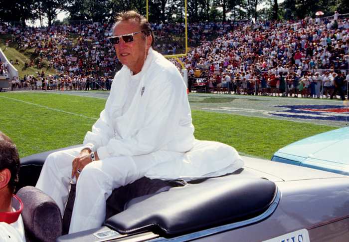 Oakland Raiders owner Al Davis acknowledges fans at the 1992 Hall of Fame game at Fawcett Stadium.
